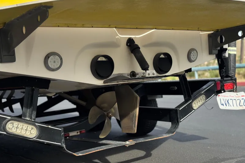 Slide: The Image of Rear view of a 2006 Tigé 22V boat showing propeller and trailer details. - 8