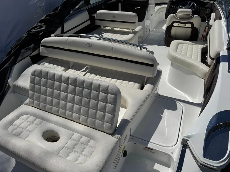Slide: The Image of Interior of a 2017 Cobalt R5 boat with white upholstered seats. - 11