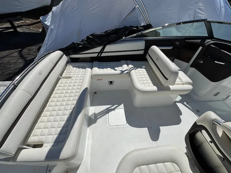 Slide: The Image of Interior of a 2017 Cobalt R5 boat with white upholstered seating. - 16
