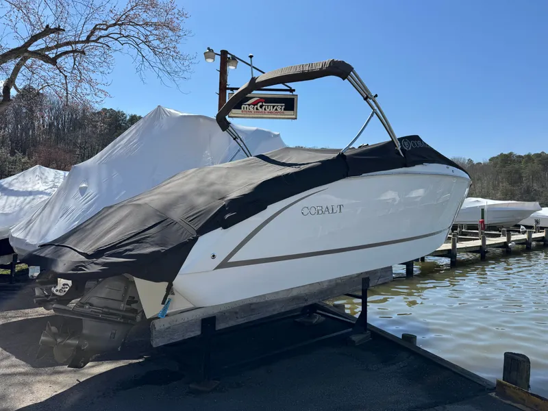 Slide: The Image of 2017 Cobalt R5 boat on a trailer by the lakeside. - 2