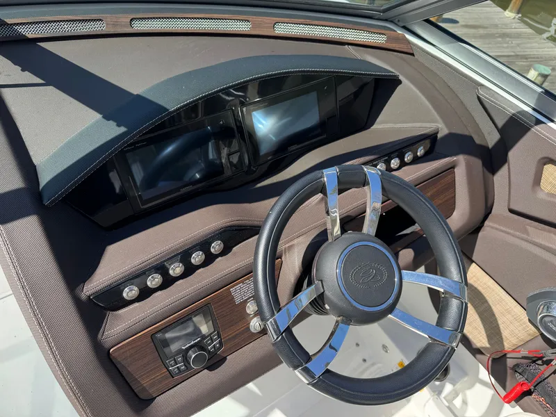 Slide: The Image of Dashboard of a 2017 Cobalt R5 boat with steering wheel and instruments. - 20