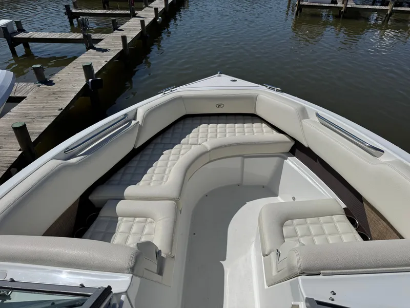 Slide: The Image of Interior view of a 2017 Cobalt R5 boat with cushioned seating. - 25