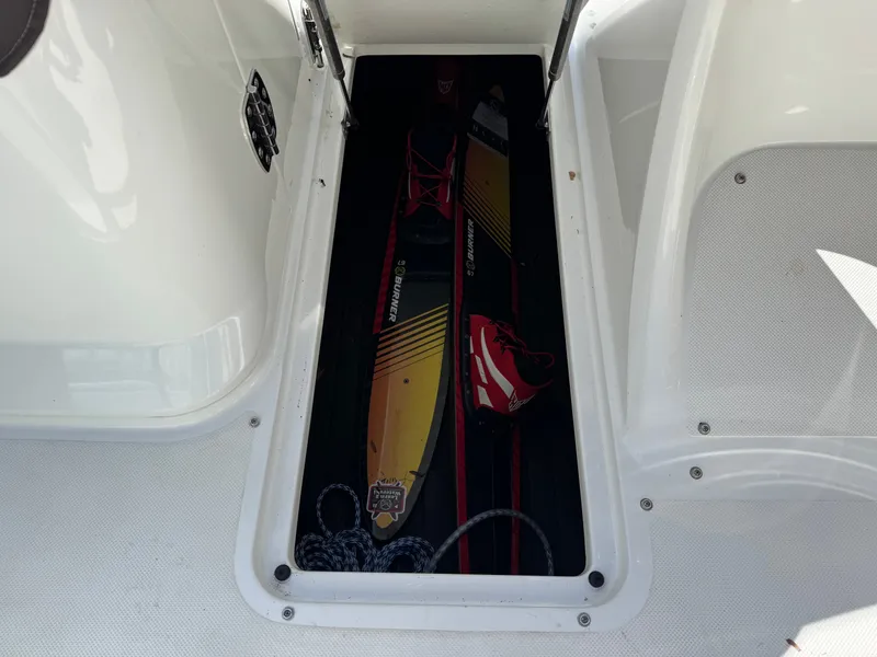 Slide: The Image of 2017 Cobalt R5 boat with water skis in storage compartment. - 29