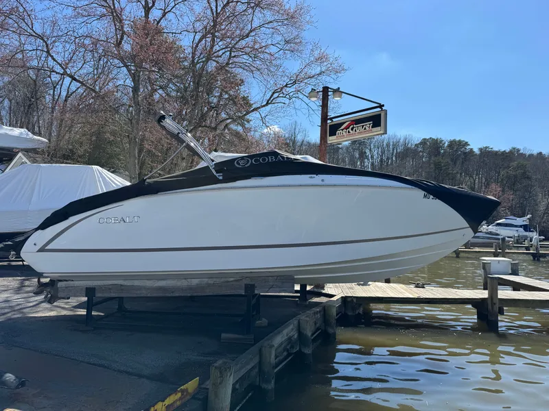 Slide: The Image of 2017 Cobalt R5 boat on a dock by the lake. - 3