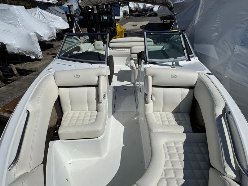 Slide: The Image of Interior of a 2017 Cobalt R5 boat with white leather seating. - 30
