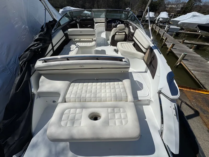 Slide: The Image of Interior of a 2017 Cobalt R5 boat with white cushioned seats. - 6
