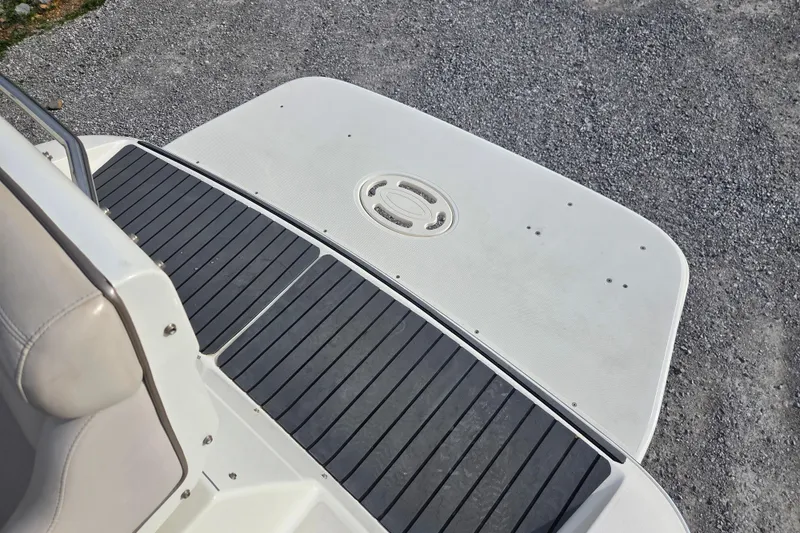 Slide: The Image of Rear deck of a 2001 Doral 270 SC boat with black non-slip surface. - 11