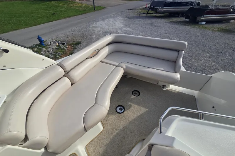 Slide: The Image of 2001 Doral 270 SC boat with beige seating and carpeted deck. - 8