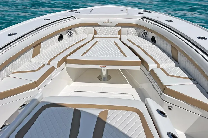 Slide: The Image of Manufacturer Provided Image: Luxurious seating on 2026 Regulator 35 boat, featuring elegant white and tan upholstery. - 5