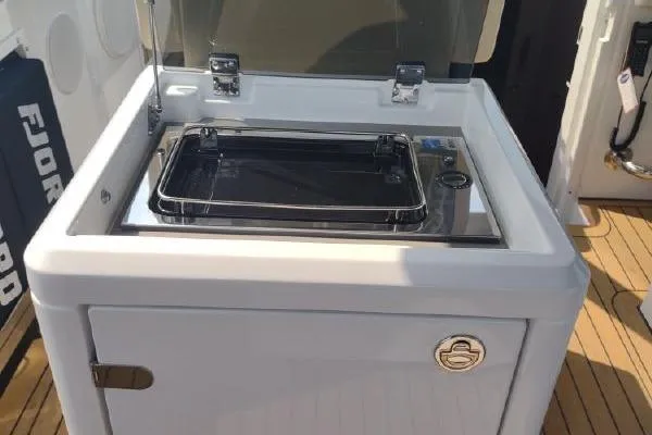 Slide: The Image of Outdoor kitchen on 2023 Fjord 41 XL yacht with sleek design and modern amenities. - 25