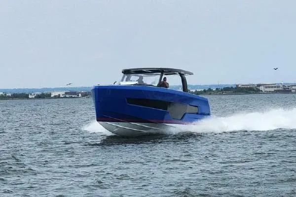 Slide: The Image of 2023 Fjord 41 XL motor yacht cruising on open water. - 7