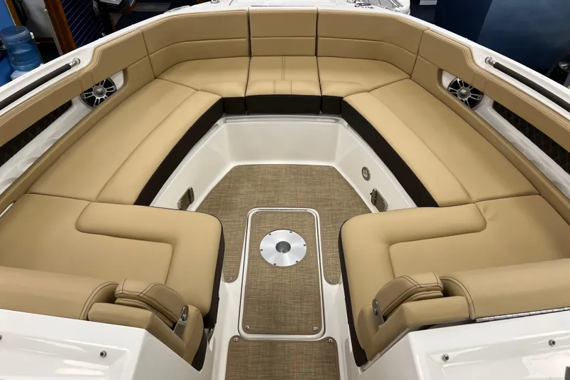 Slide: The Image of 2024 Sea Ray SLX 310 boat interior with tan seating and spacious layout. - 17