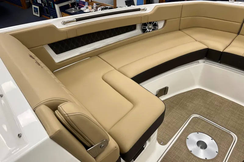 Slide: The Image of Luxurious seating area on the 2024 Sea Ray SLX 310 boat, featuring tan upholstery. - 18