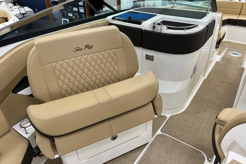 Slide: The Image of 2024 Sea Ray SLX 310 boat interior with tan leather seating and modern design. - 37