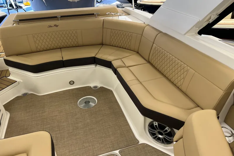 Slide: The Image of Luxurious seating area on 2024 Sea Ray SLX 310 boat with tan upholstery and elegant design. - 8