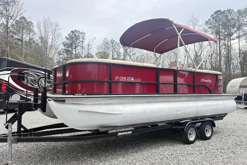 The Image of 2022 Bentley Pontoons 220 Navigator on trailer, red exterior, parked outdoors. - 0