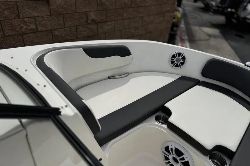 Slide: The Image of 2019 Bayliner VR6 Bowrider I/O interior with cushioned seating and speaker system. - 12