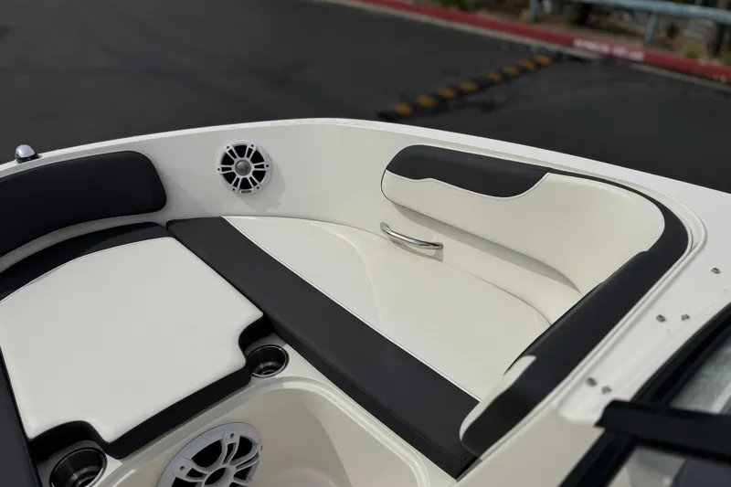Slide: The Image of 2019 Bayliner VR6 Bowrider I/O boat interior with cushioned seating and speaker. - 13