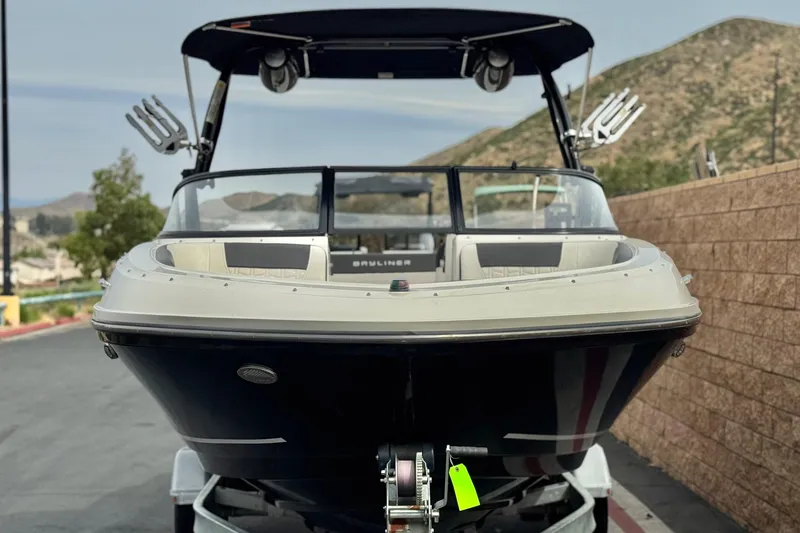 Slide: The Image of 2019 Bayliner VR6 Bowrider I/O boat on trailer, front view, outdoors. - 2