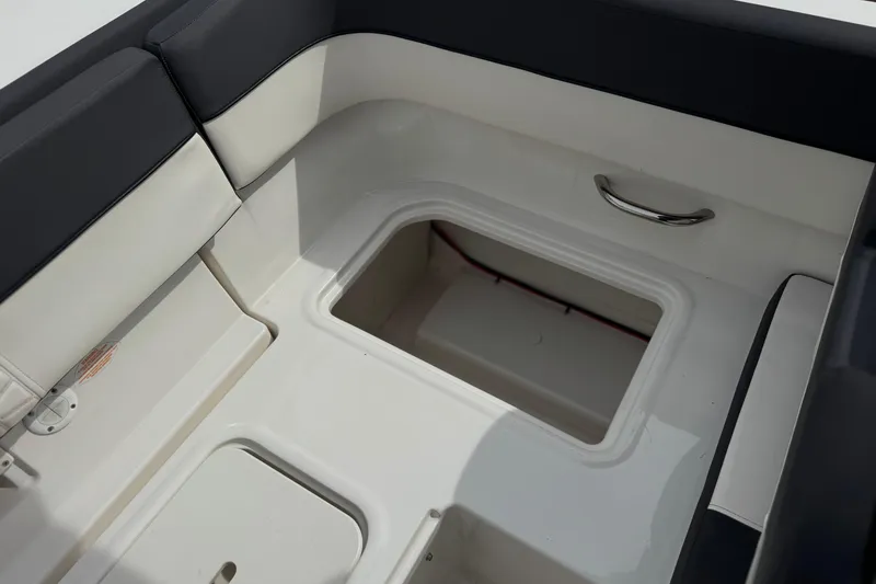 Slide: The Image of 2019 Bayliner VR6 Bowrider I/O interior storage compartment with cushioned seating. - 21