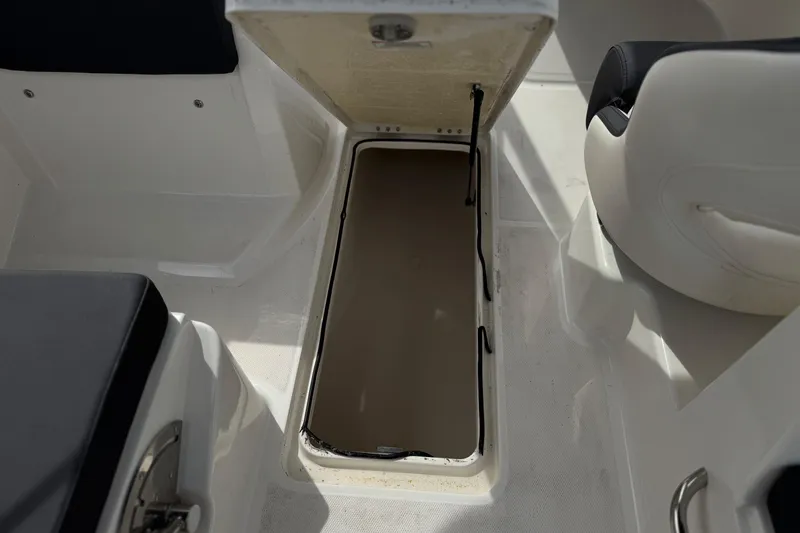 Slide: The Image of 2019 Bayliner VR6 Bowrider I/O open storage compartment, showcasing interior seating and design. - 23