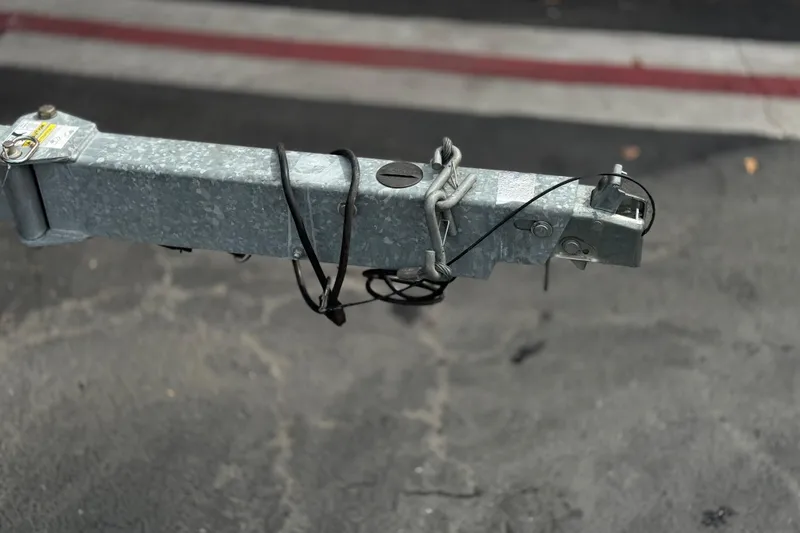 Slide: The Image of Trailer hitch of a 2019 Bayliner VR6 Bowrider I/O on asphalt. - 39