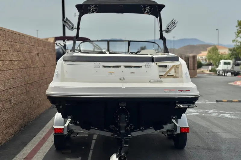 Slide: The Image of 2019 Bayliner VR6 Bowrider I/O on trailer, rear view, parked outdoors. - 4