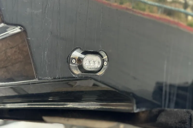 Slide: The Image of 2019 Bayliner VR6 Bowrider I/O boat detail showing underwater LED light. - 8