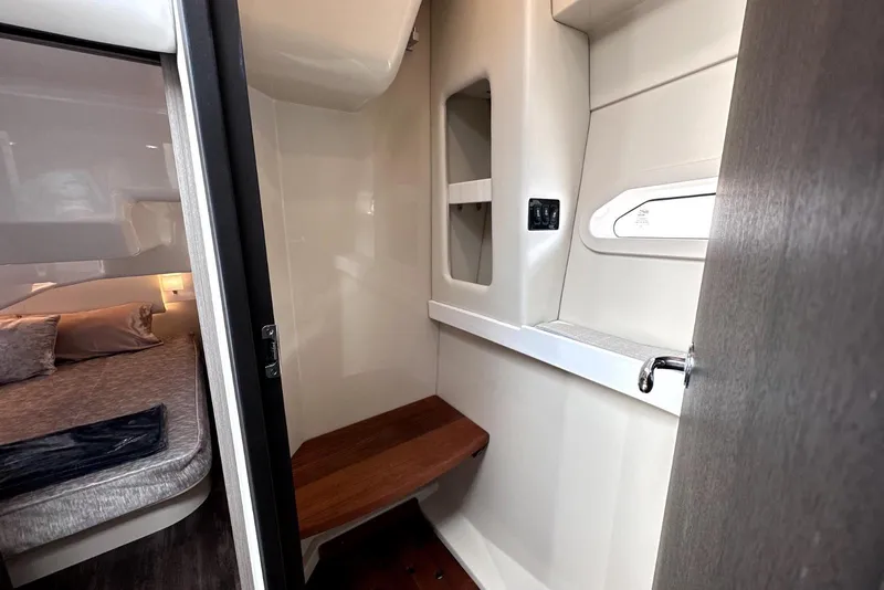 Slide: The Image of 2021 Regal 38 XO interior cabin with cozy bed and modern design elements. - 34