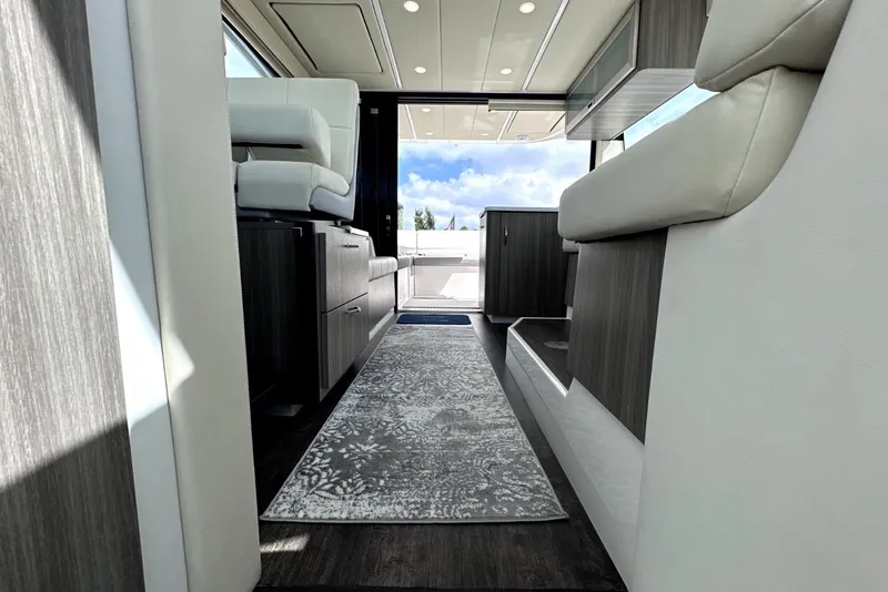 Slide: The Image of Interior view of 2021 Regal 38 XO yacht, featuring modern seating and elegant design. - 35