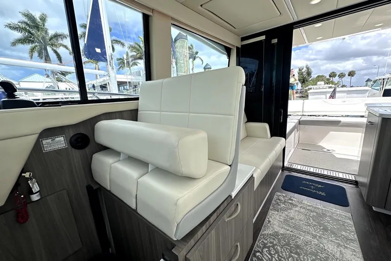 Slide: The Image of Interior of 2021 Regal 38 XO yacht with white seating and modern design. - 42