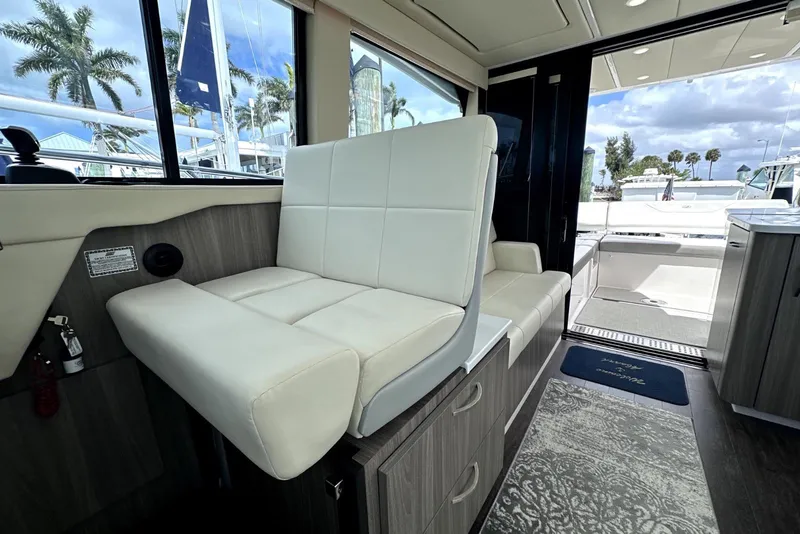 Slide: The Image of Interior of 2021 Regal 38 XO yacht with white seating and modern design. - 43