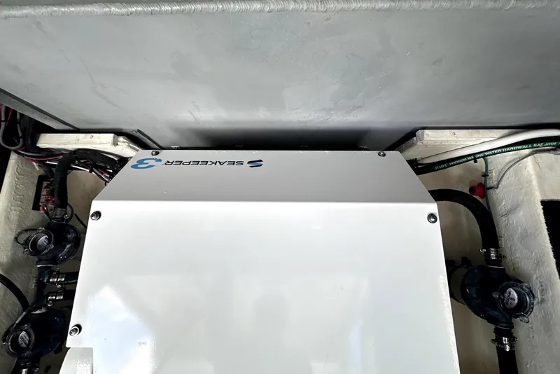 Slide: The Image of Engine compartment of 2021 Regal 38 XO boat featuring Seakeeper 3 stabilizer. - 49