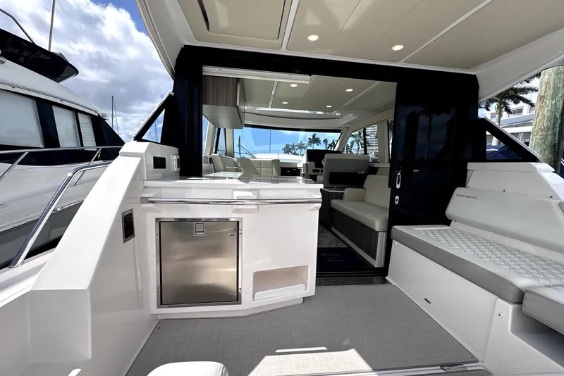 Slide: The Image of 2021 Regal 38 XO yacht interior with modern seating and sleek design. - 7