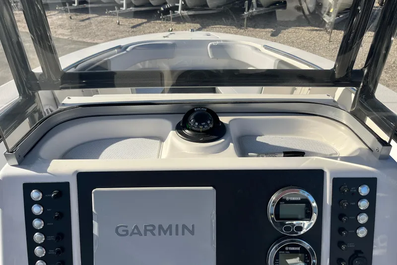 Slide: The Image of 2026 Robalo R200 Center Console dashboard with Garmin navigation and Yamaha controls. - 14