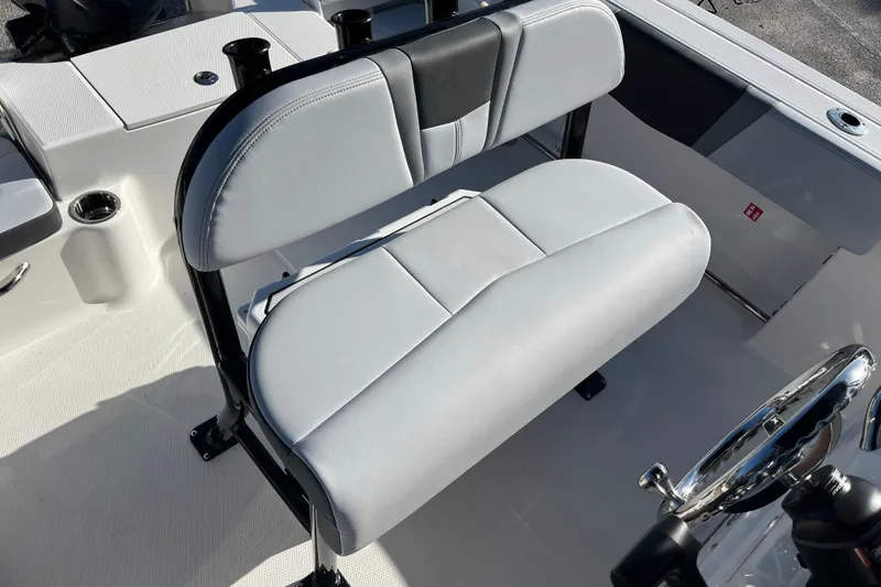 Slide: The Image of 2026 Robalo R200 Center Console boat seat and steering wheel detail. - 23