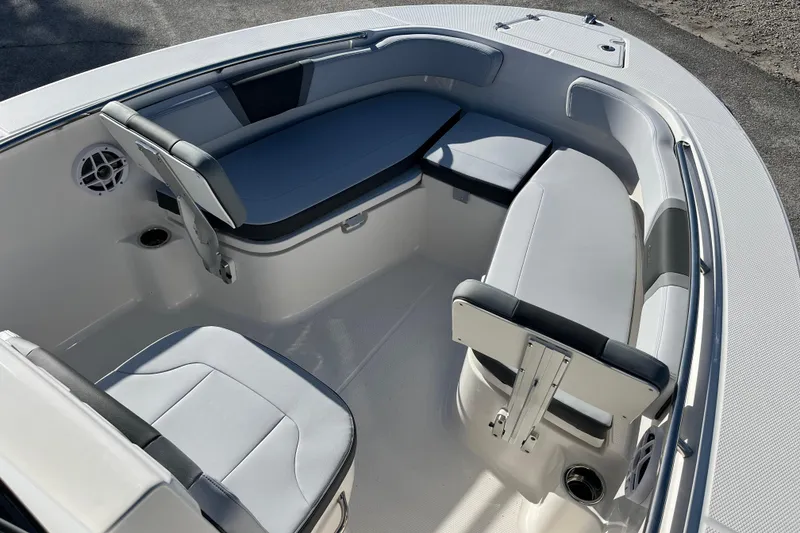 Slide: The Image of 2026 Robalo R200 Center Console boat interior with cushioned seating and sleek design. - 24