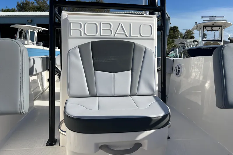 Slide: The Image of 2026 Robalo R200 Center Console boat seat with logo, showcasing sleek design. - 26
