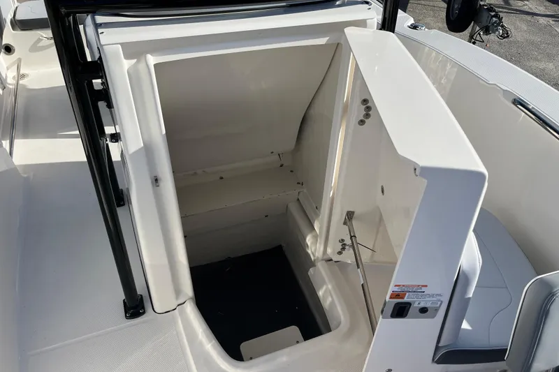Slide: The Image of 2026 Robalo R200 Center Console boat storage compartment, open and spacious design. - 27