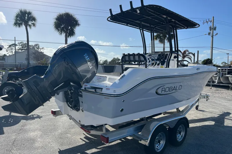 Slide: The Image of 2026 Robalo R200 Center Console boat with Yamaha engine on trailer. - 4