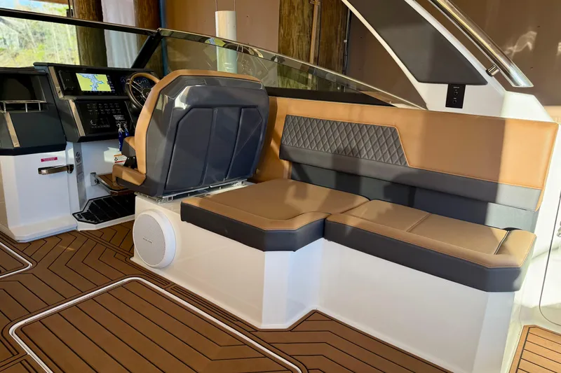 Slide: The Image of Luxurious interior of 2025 Cobalt R33 boat with leather seating and modern dashboard. - 11