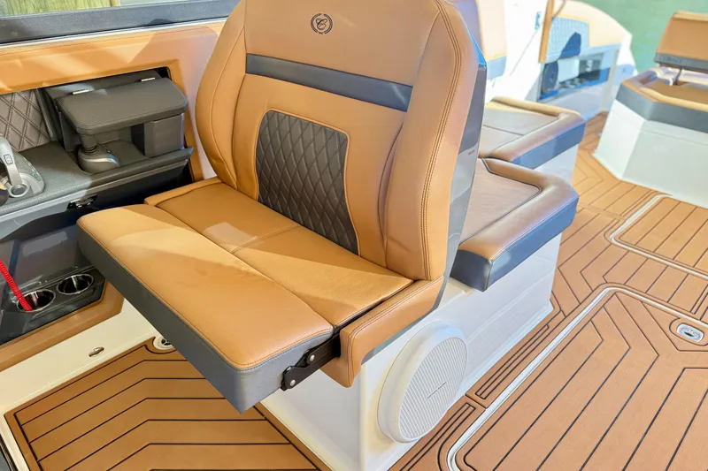 Slide: The Image of Luxurious seating in 2025 Cobalt R33 boat, featuring tan leather and modern design. - 13