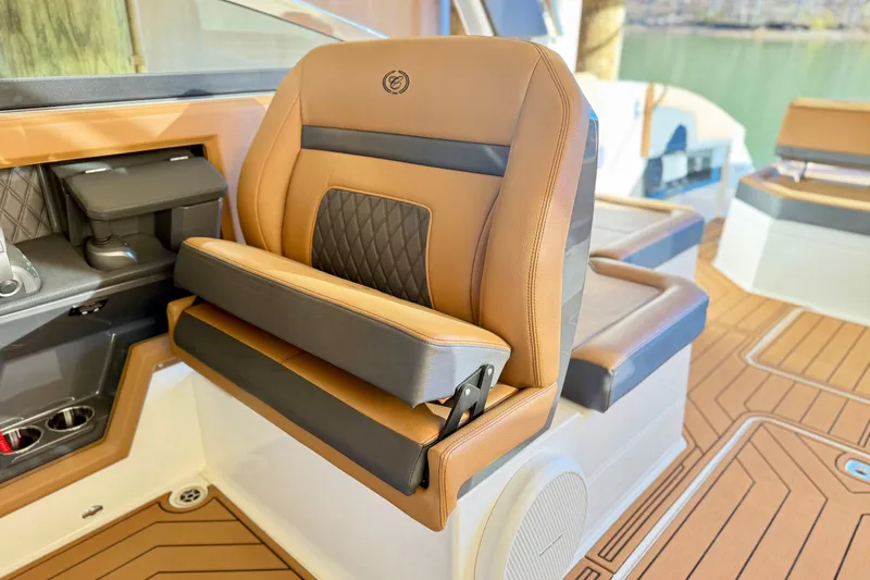Slide: The Image of Luxurious seating on 2025 Cobalt R33 boat with tan and black upholstery. - 14