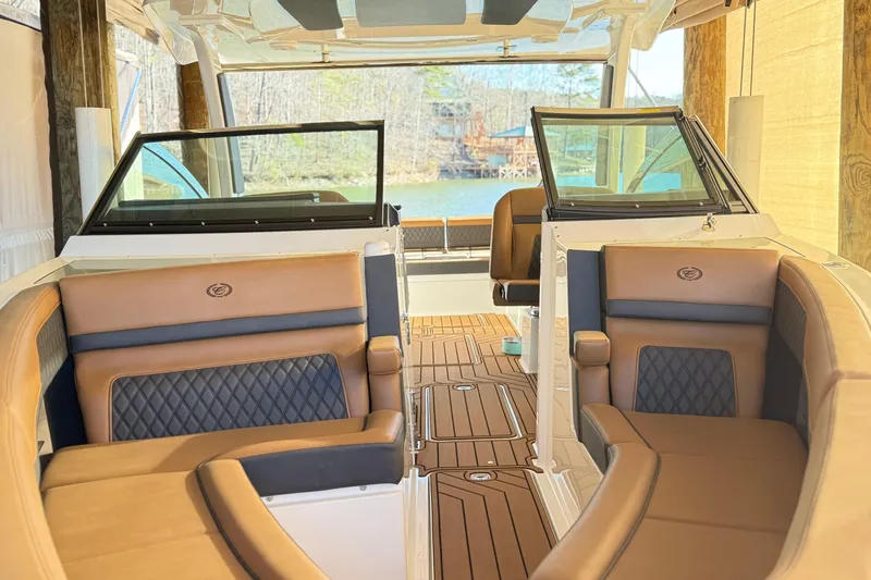 Slide: The Image of Luxurious interior of 2025 Cobalt R33 boat with elegant seating and wood flooring. - 26