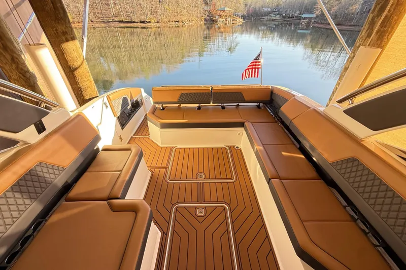 Slide: The Image of Luxurious interior of 2025 Cobalt R33 boat with elegant seating and lake view. - 30