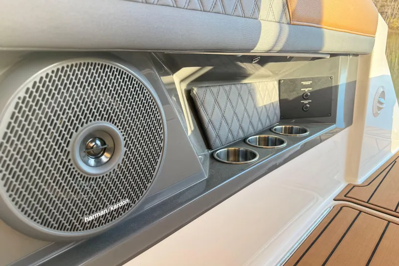 Slide: The Image of Speaker and cup holders on 2025 Cobalt R33 boat interior. - 34