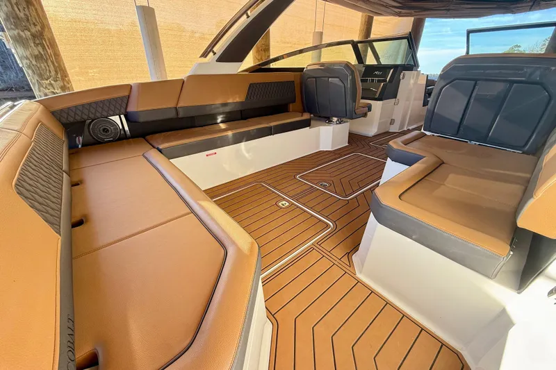 Slide: The Image of Luxurious interior of 2025 Cobalt R33 boat with elegant seating and wood-style flooring. - 9