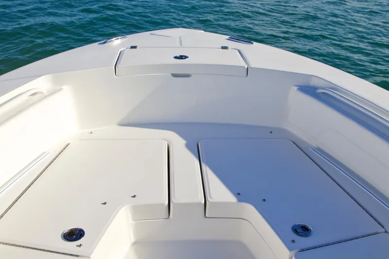 Slide: The Image of Manufacturer Provided Image: Bow deck of 2025 Regulator 24XO boat on calm water. - 6