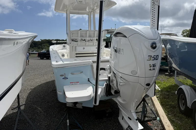 Slide: The Image of 2025 Regulator 24XO boat with Yamaha 350 V6 engine displayed outdoors. - 3