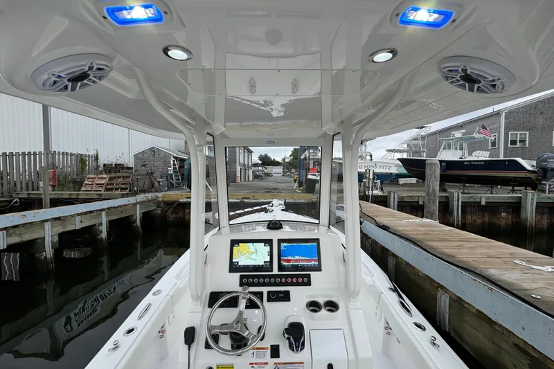 Slide: The Image of 2025 Regulator 24XO boat cockpit with advanced navigation system and blue LED lights. - 15